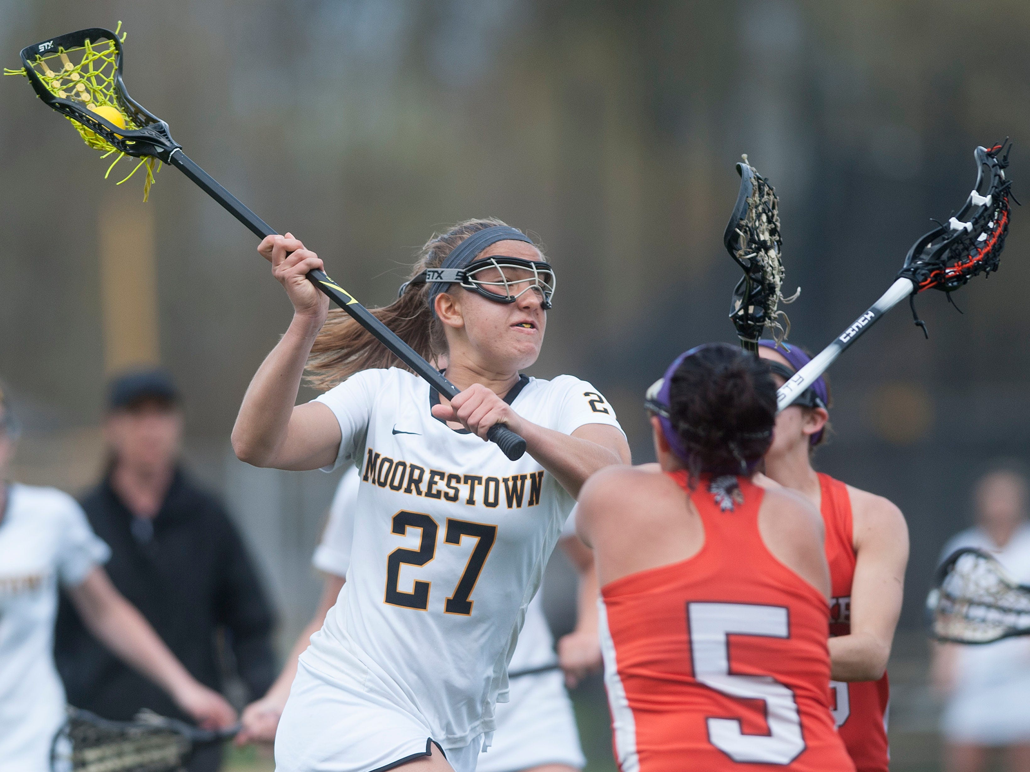 Moorestown's Alex O'Donnell, left, shoots over Cherokee's Lisa DiLullo, center, and Cherokee's Savannah Singer, right, during the 1st half of Wednesdays game played in Moorestown. 04.22.15