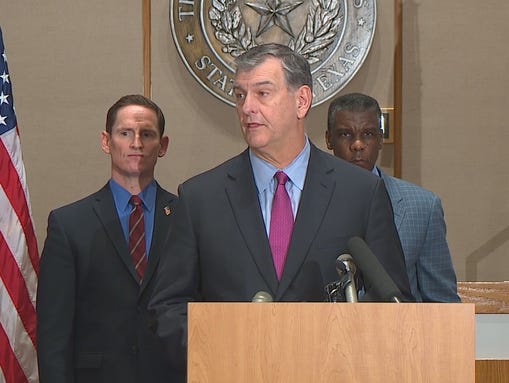 Dallas Mayor Mike Rawlings speaks at a news conference.