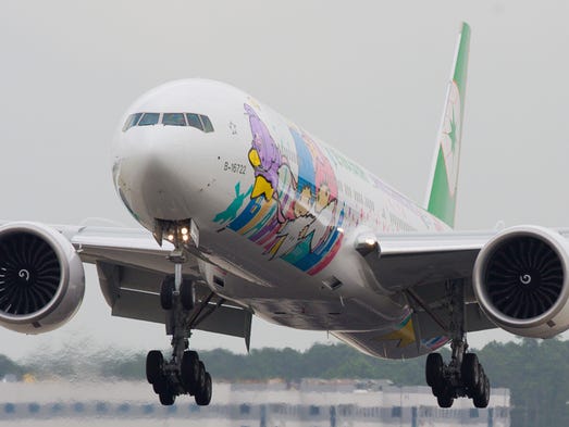 EVA Air's newest Hello Kitty Boeing 777-300ER jet lands