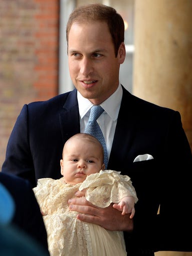 Today's the big day! Prince George is getting christened. Prince William holds his son as they arrive at Chapel Royal in St James's Palace in London.