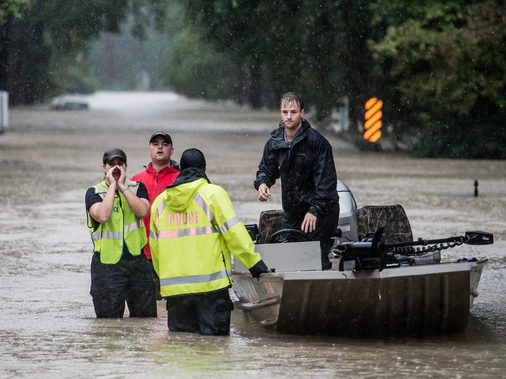 Residents and first responders launch boats to rescue people trapped in their homes in Columbia, S.C. South Carolina experienced a record rainfall, with 11.5 inches falling on Oct 3.