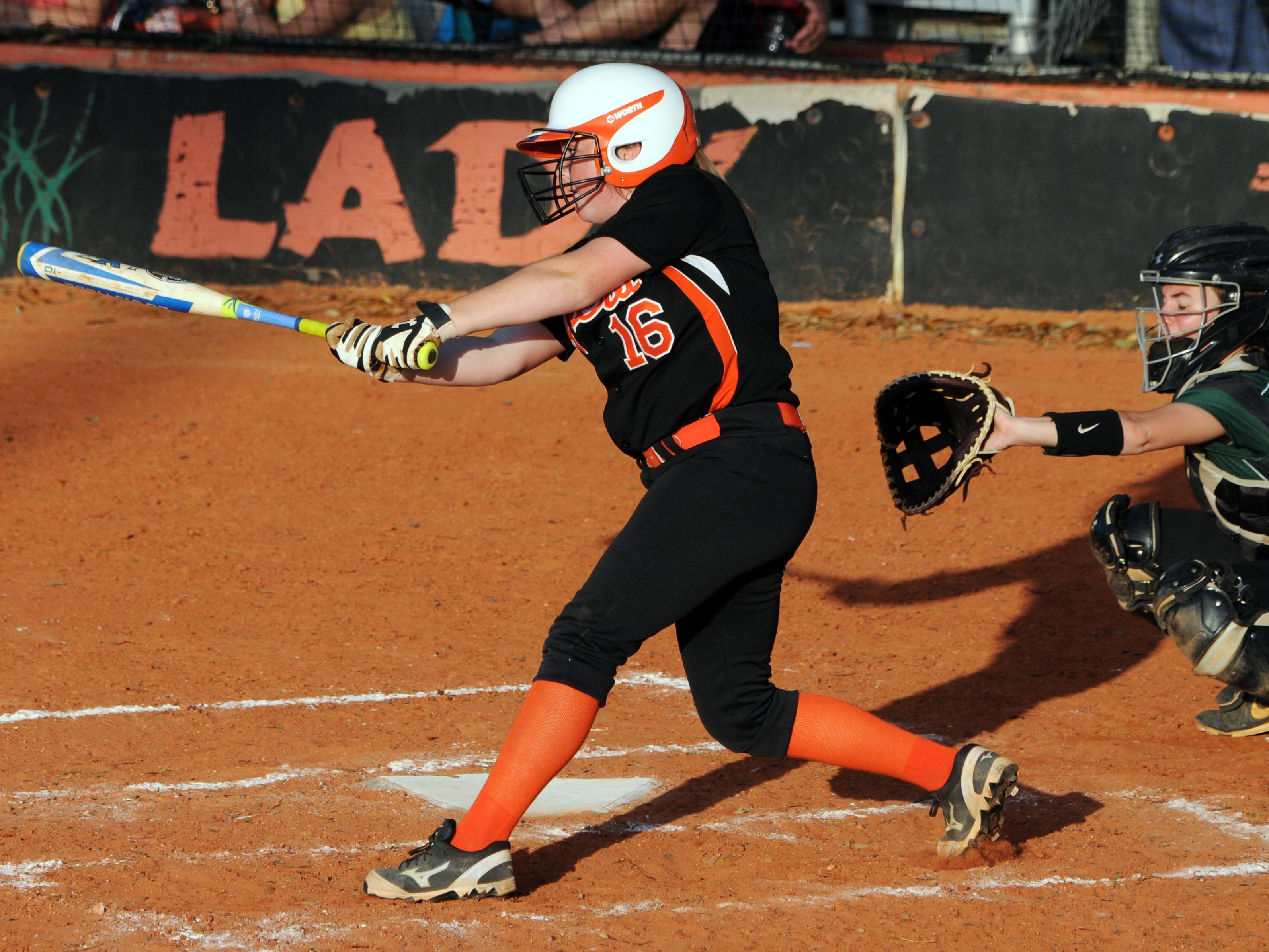 Cocoa's Savannah Pruitt puts the ball in play during Thursday's game against Melbourne.
