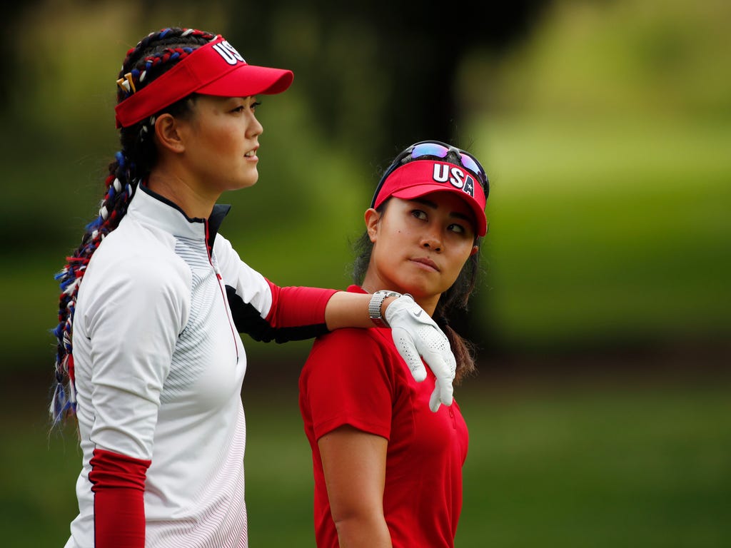 Michelle Wie and Danielle Kang both of the U.S. walk the 4th hole together during the first day of practice during The Solheim Cup International Golf Tournament at the Des Moines Golf and Country Club in West  Des Moines, Iowa.