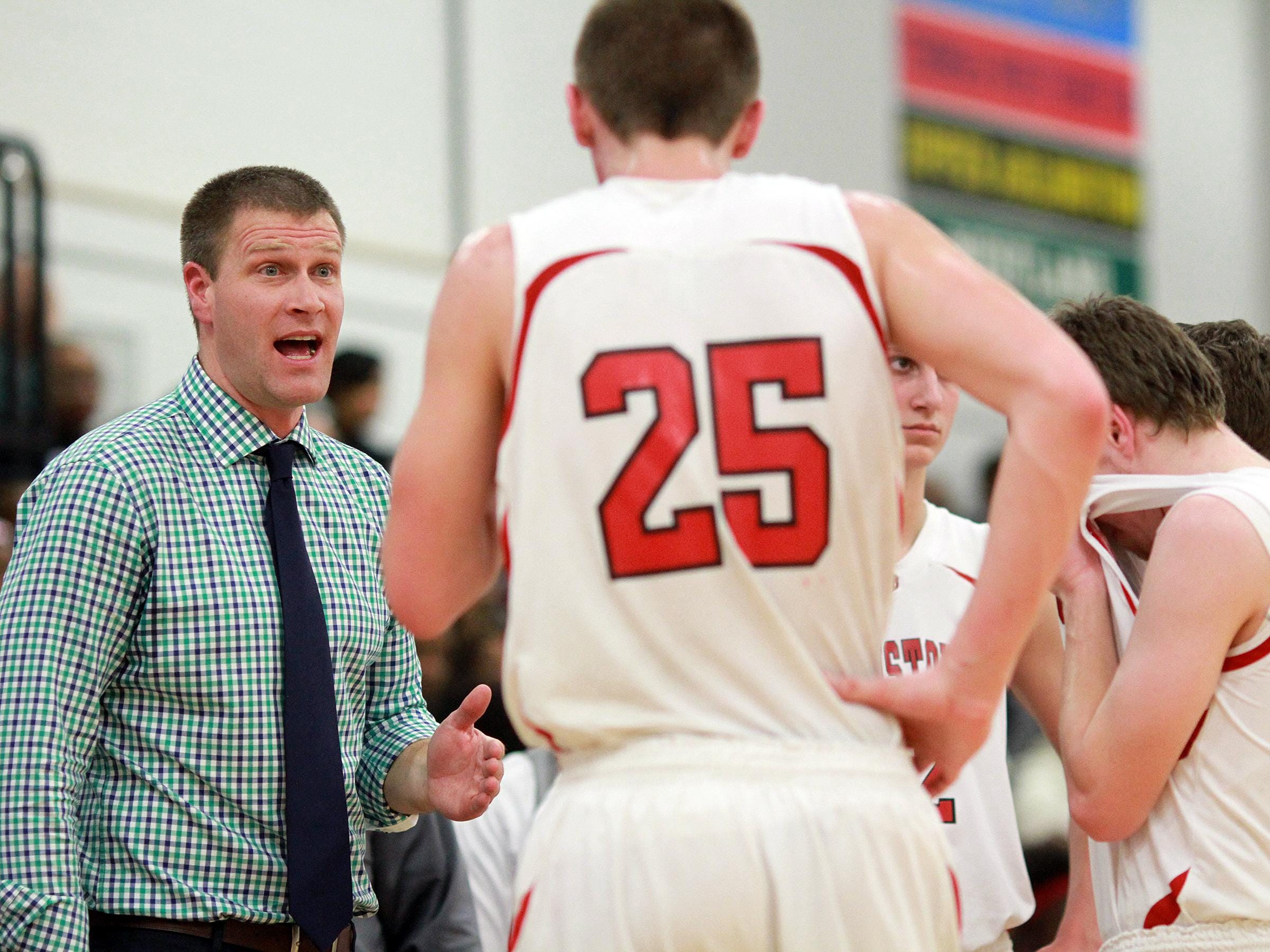 Johnstown coach Kevin Martin talks to his team during a 2014-15 game.