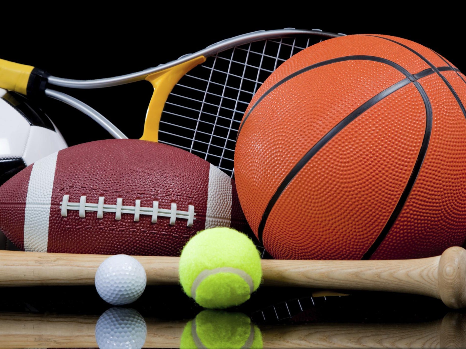 Assorted Sports Equipment on Black