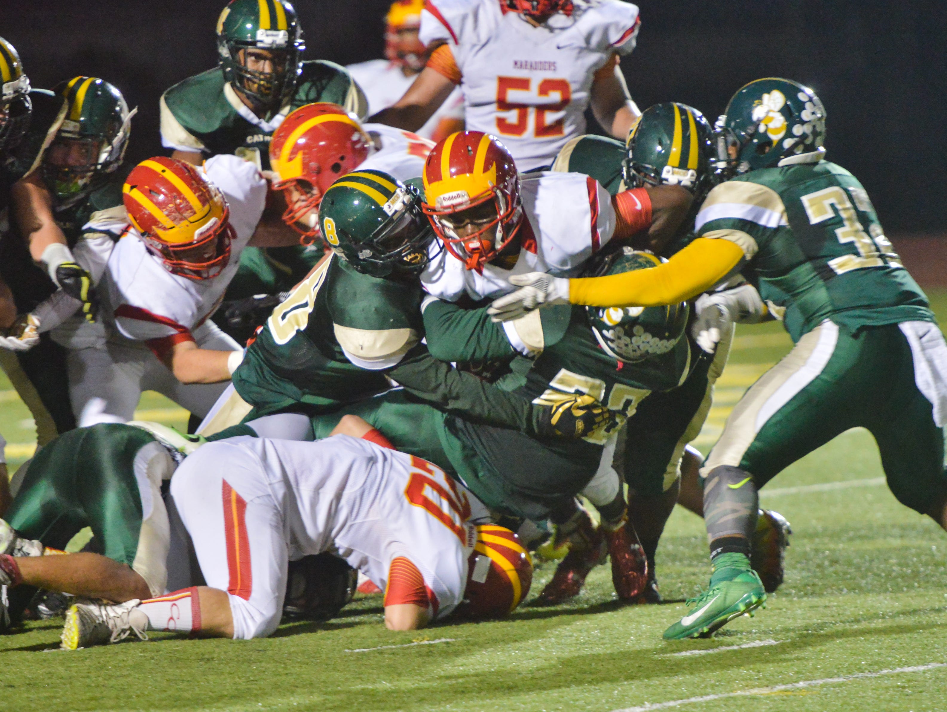 The Melbourne Central Catholic defense stops Clearwater Central Catholic from scoring on a fourth down during the second quarter.