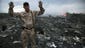 A man gestures at the crash site.