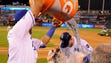 Aug. 11: Royals catcher Salvador Perez dumps the water