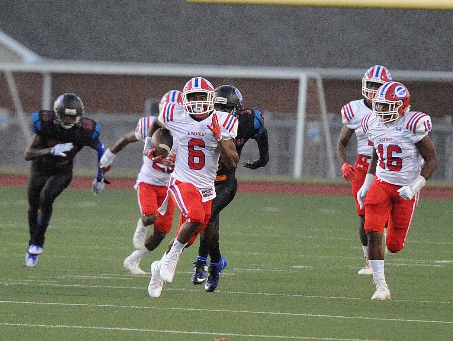 Evangel's Orlando Puryear (6) tries to outrun the Southwood defense.