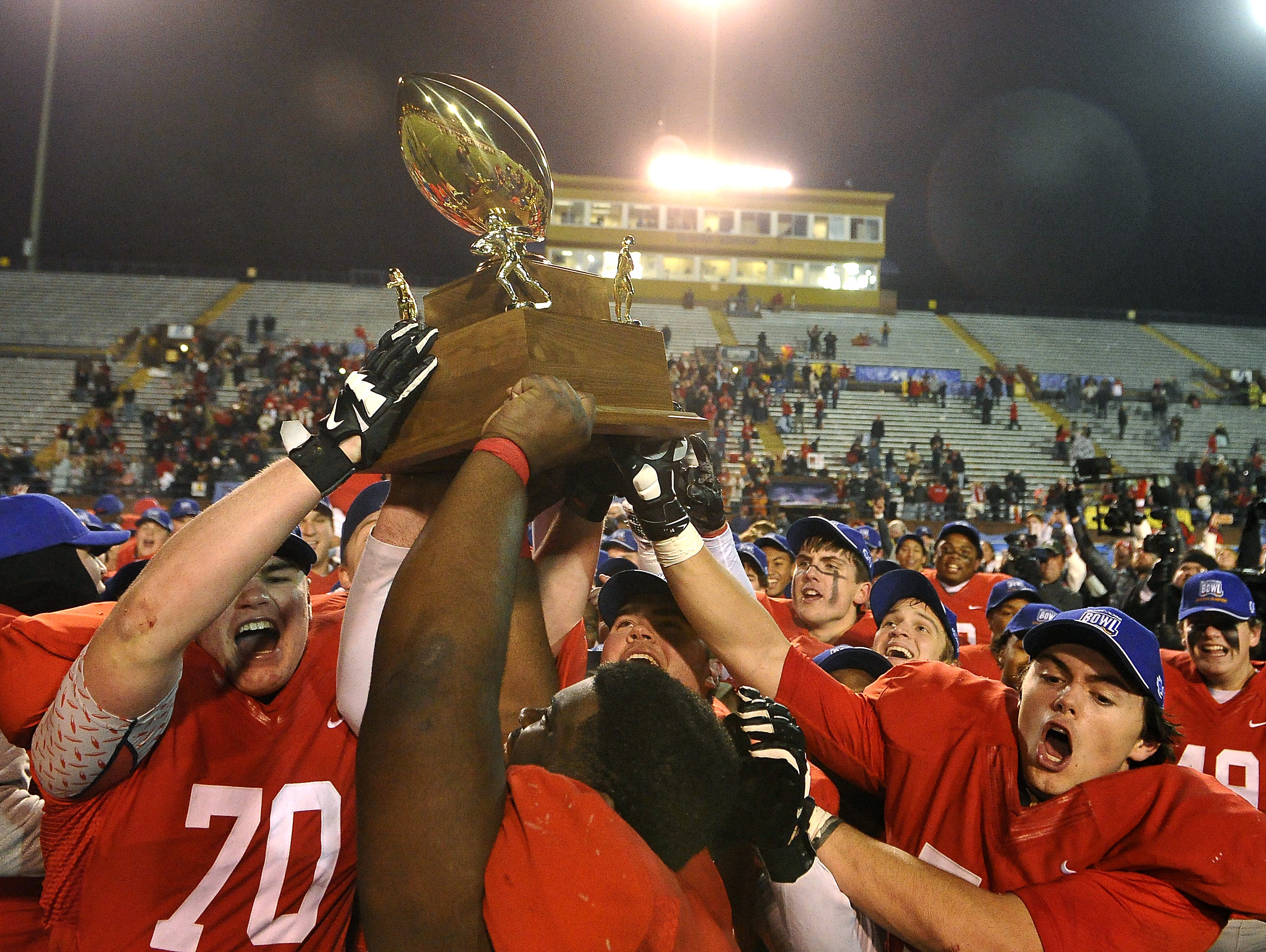 Brentwood Academy hoists the DII-AA state championship trophy after Thursday's win.