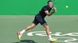 Jack Sock of the United States hits a backhand to Taro