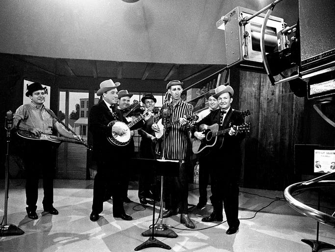 David "Stringbean" Akeman, striped shirt, performs with Lester Flatt and Earl Scruggs during a taping of the "Lester Flatt and Earl Scruggs Show" on Sept. 11, 1963.