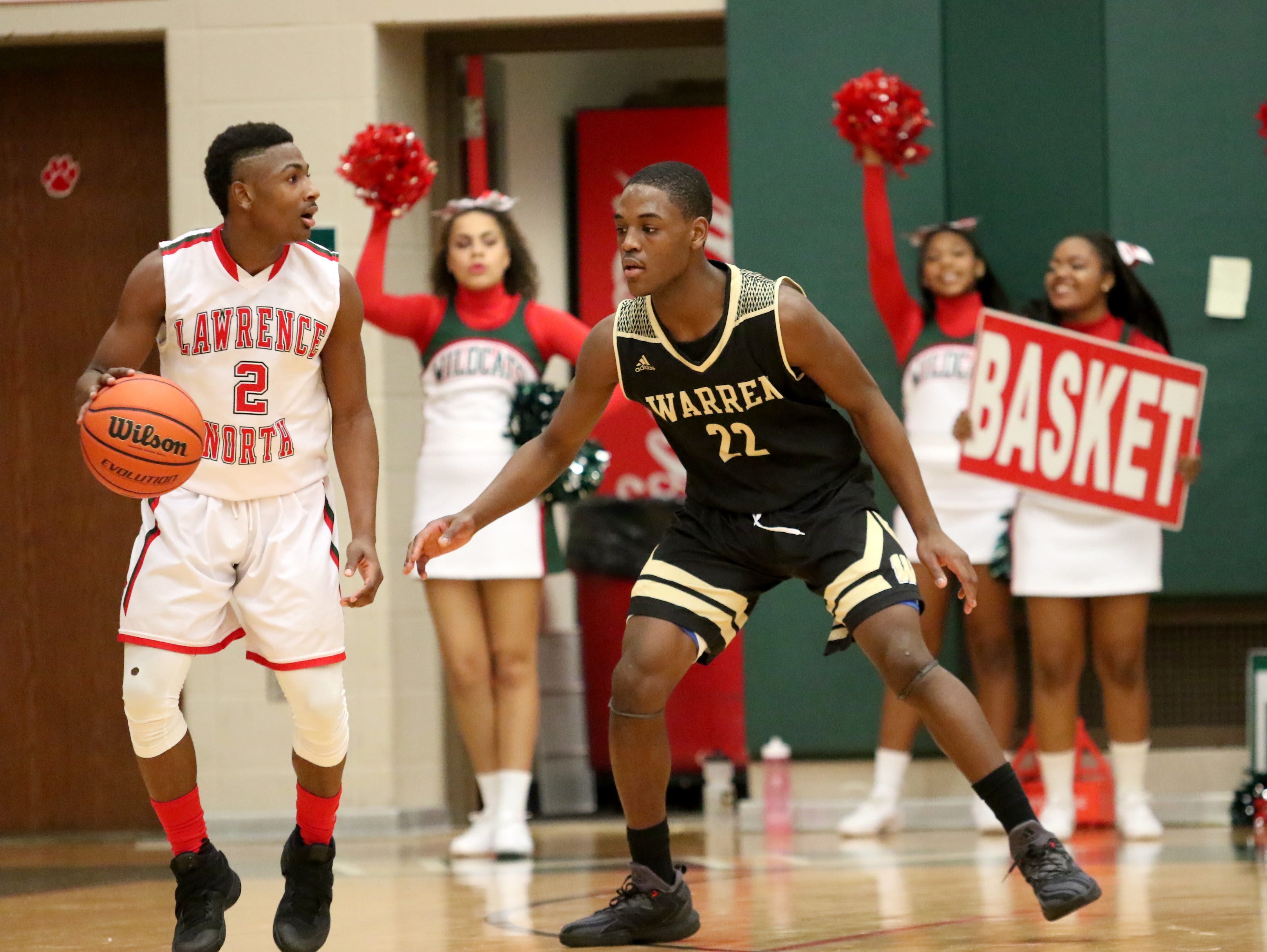 Warren Central's David Bell guards Lawrence North's Antwaan Cushingberry during Friday night's game in Indianapolis.