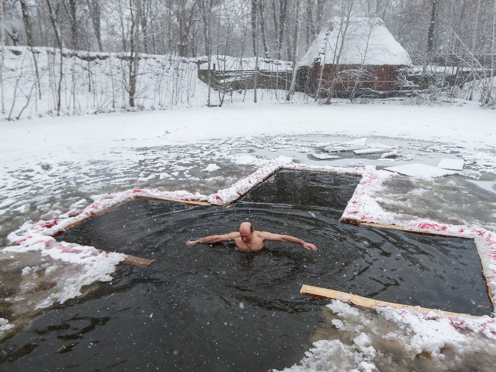 An Orthodox believer bathes in cold water during Epiphany celebrations in Kiev, Ukraine.  During Epiphany, some people believe that the waters have special curative properties and can be used to treat various illnesses, and many of them take icy bath