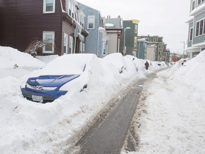 BOSTON, MA - FEBRUARY 10: Cars remain buried on East