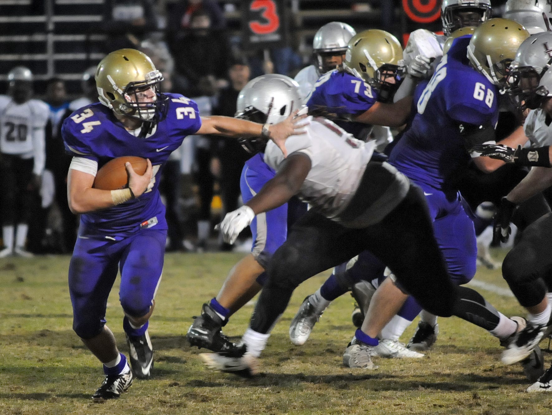 CPA's James Deaton looks to get by Liberty Magnet defenders in the fourth quarter of CPA's 21-0 3A semifinal win.