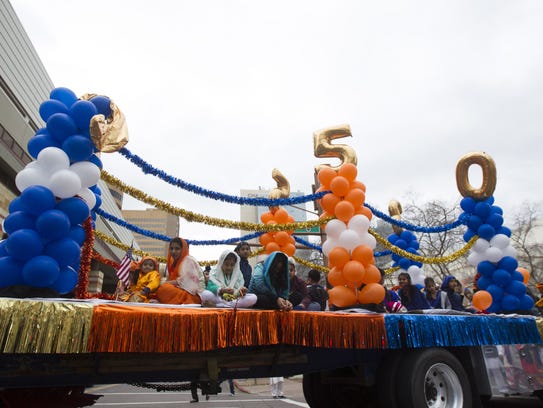 Members of Arizona's Sikh community march in a parade