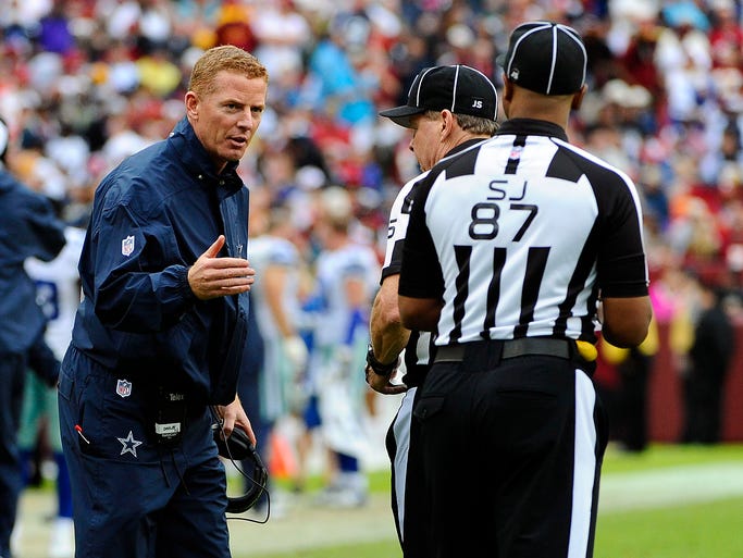 Dallas Cowboys head coach Jason Garrett talks with the officials.