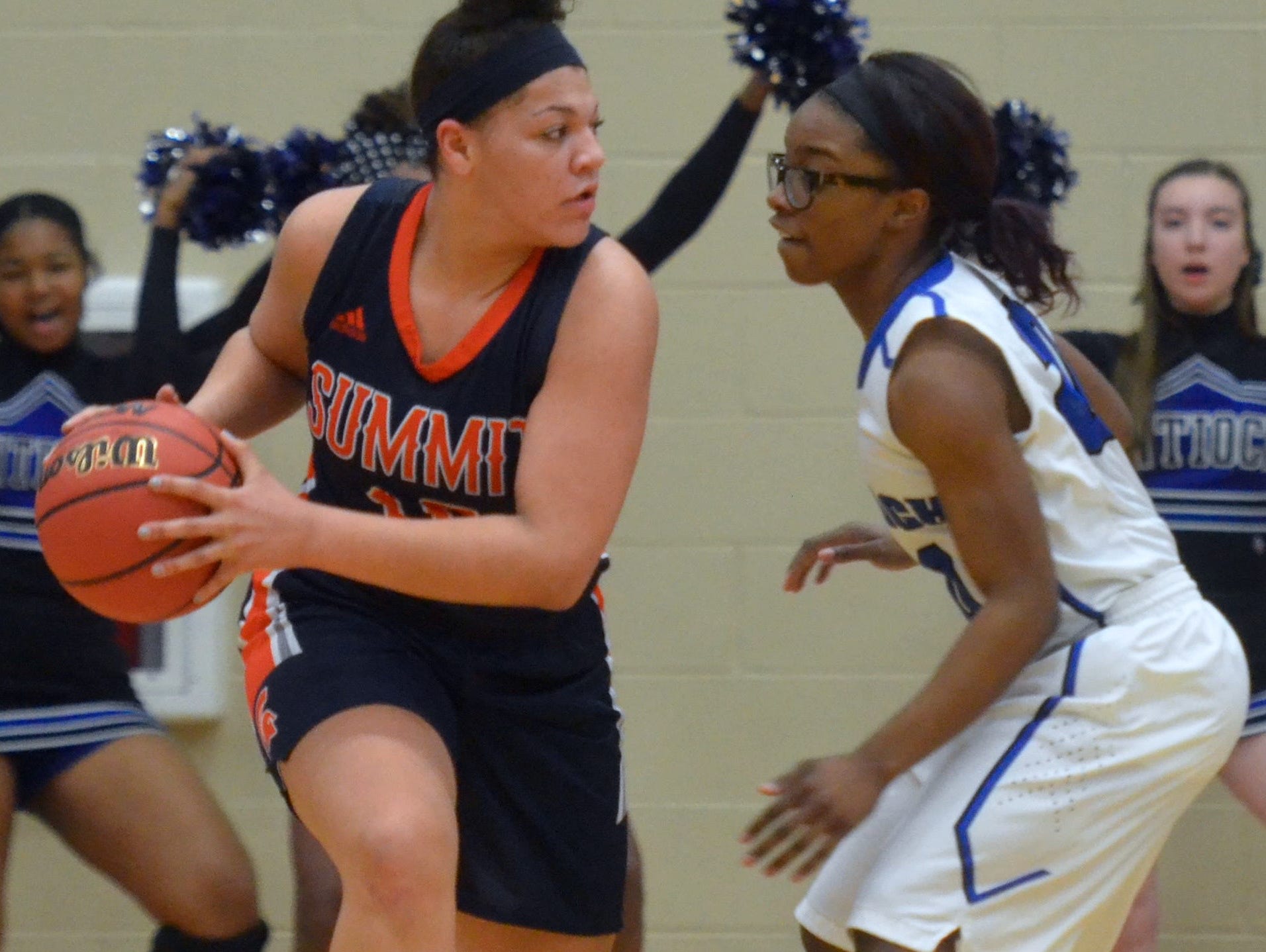 Summit sophomore Olivia Colson (left) looks for a passing lane around Antioch senior Shontoia Blackburn during Friday’s Region 6-AAA quarterfinal at Cane Ridge High School.