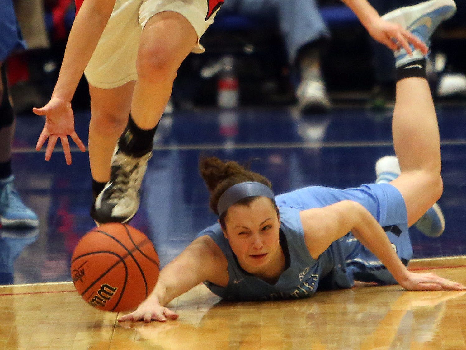 Rye's Madeline Eck (21) steals the ball away from Saugerties Kellyann Averill (25) during the Class A girls basketball regional semifinal at the Westchester County Center in White Plains March 1, 2016. Rye won the game 57-37.