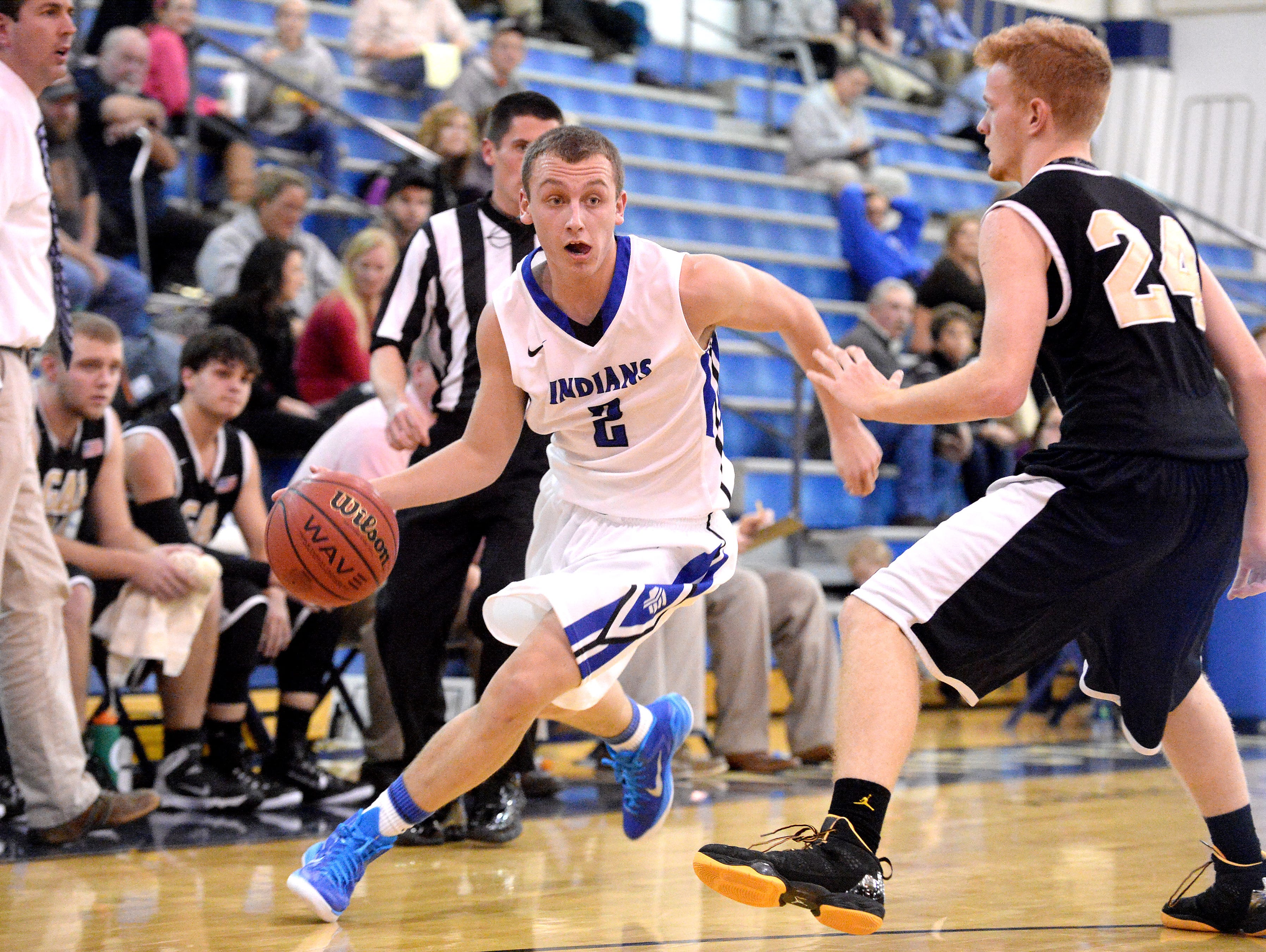Fort Defiance’s Brendan Crowe tries to drive the ball past Buffalo Gap’s Zach Thompson during their game Thursday in Fort Defiance.