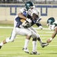 Mansfield's D'Andre Bailey tries to get past Huntington's defense Thursday evening at Independence Stadium.