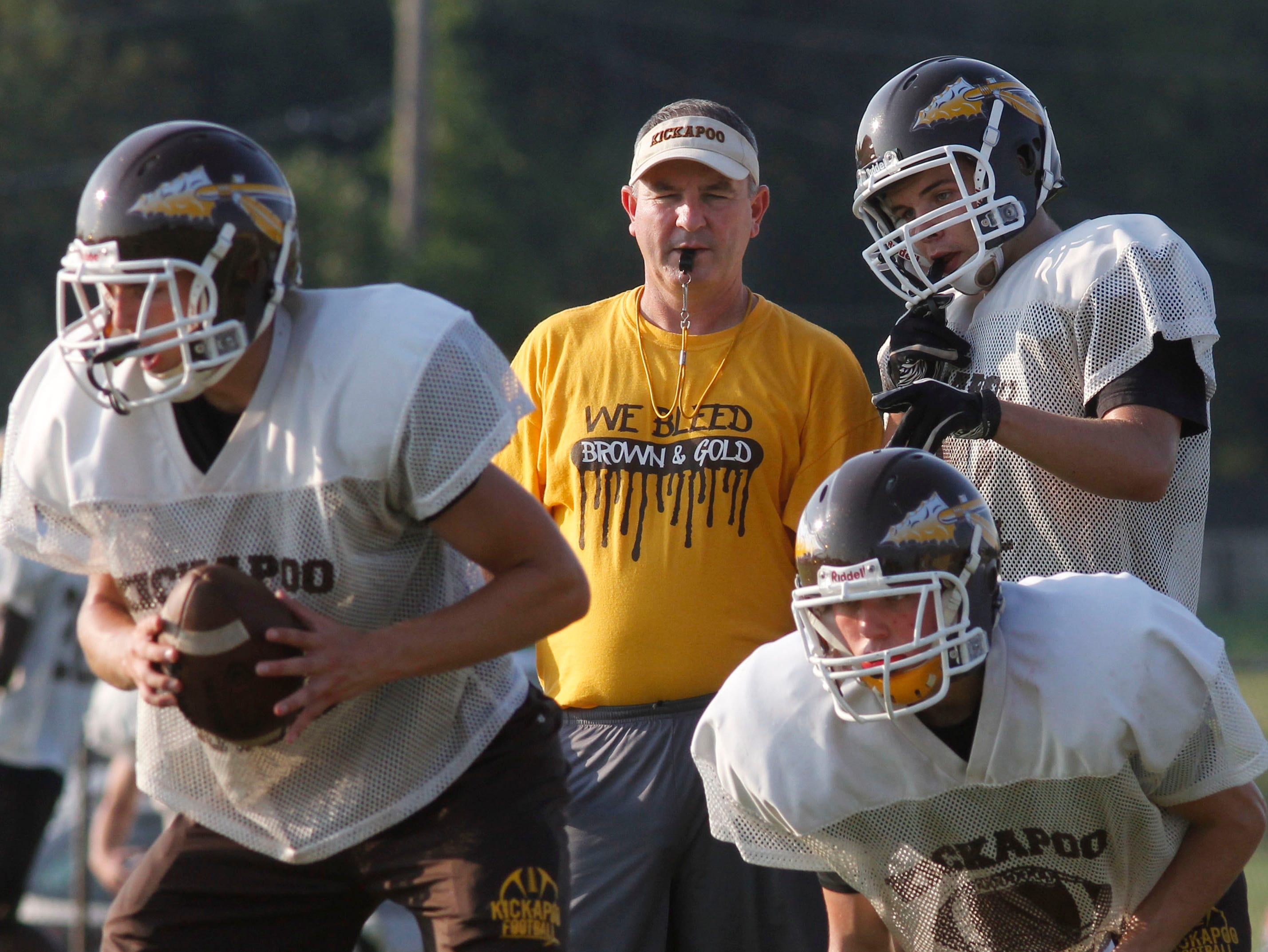 Kickapoo’s Joel Wells takes a business-like approach into the pre-game speeches to his team.