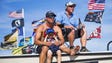 Racing fans Nick Bugni, left and his son, Parker, 5,