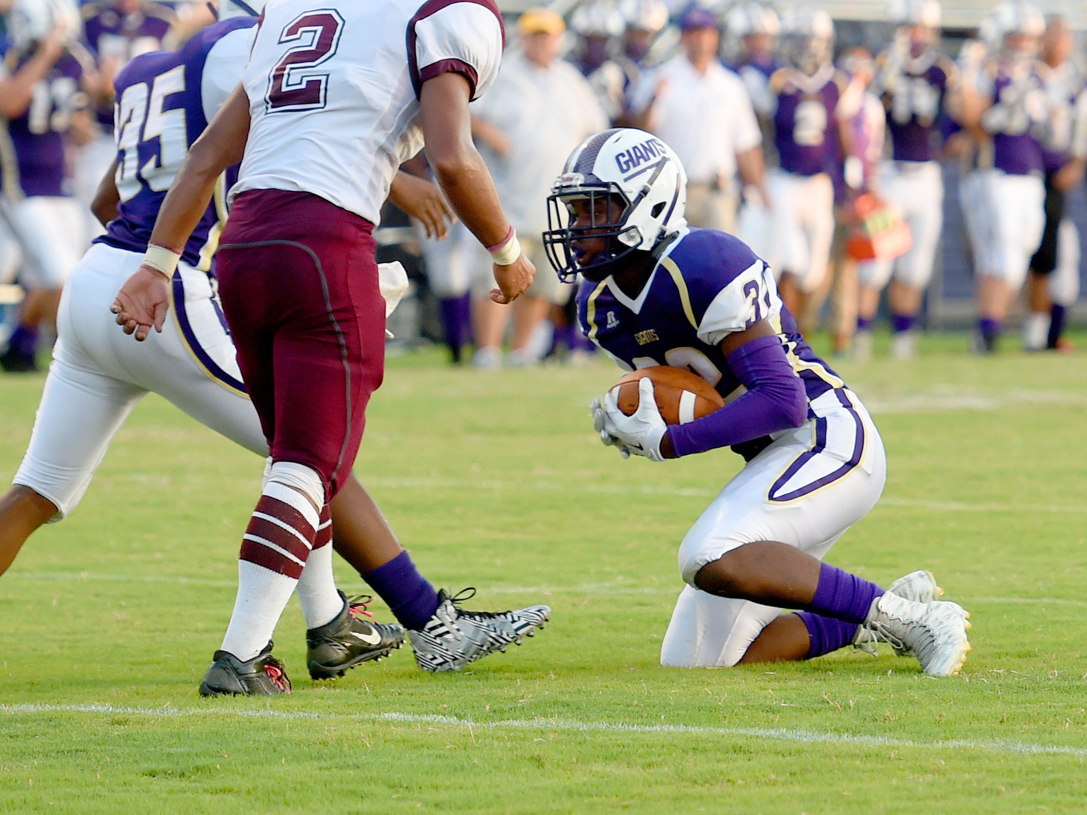 Waynesboro's Savion Jackson comes away with an interception during a football game played in Waynesboro on Friday, Sept. 11, 2015.