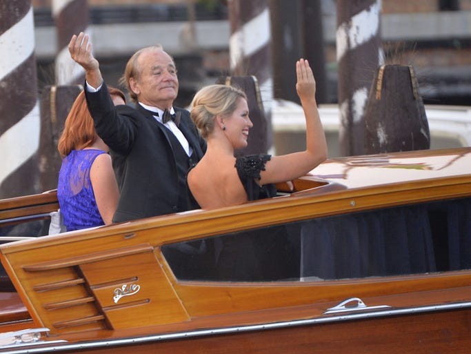 Another of Clooney's 'Monuments Men,' Bill Murray waves to spectators.