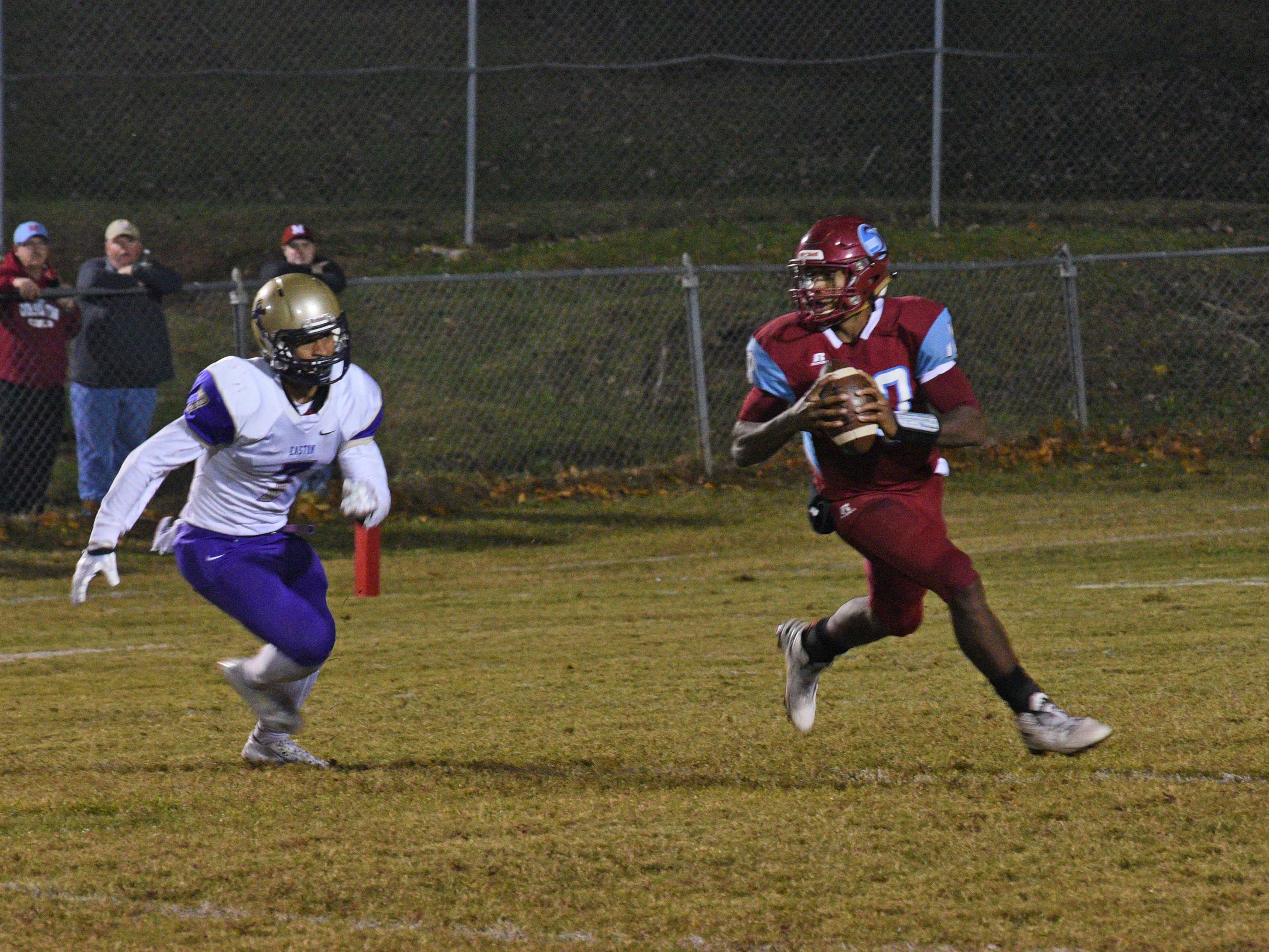 Minden’s Antonio Rivette looks for a receiver down field against Warren Easton in a third-round Class 4A playoff game Friday night.