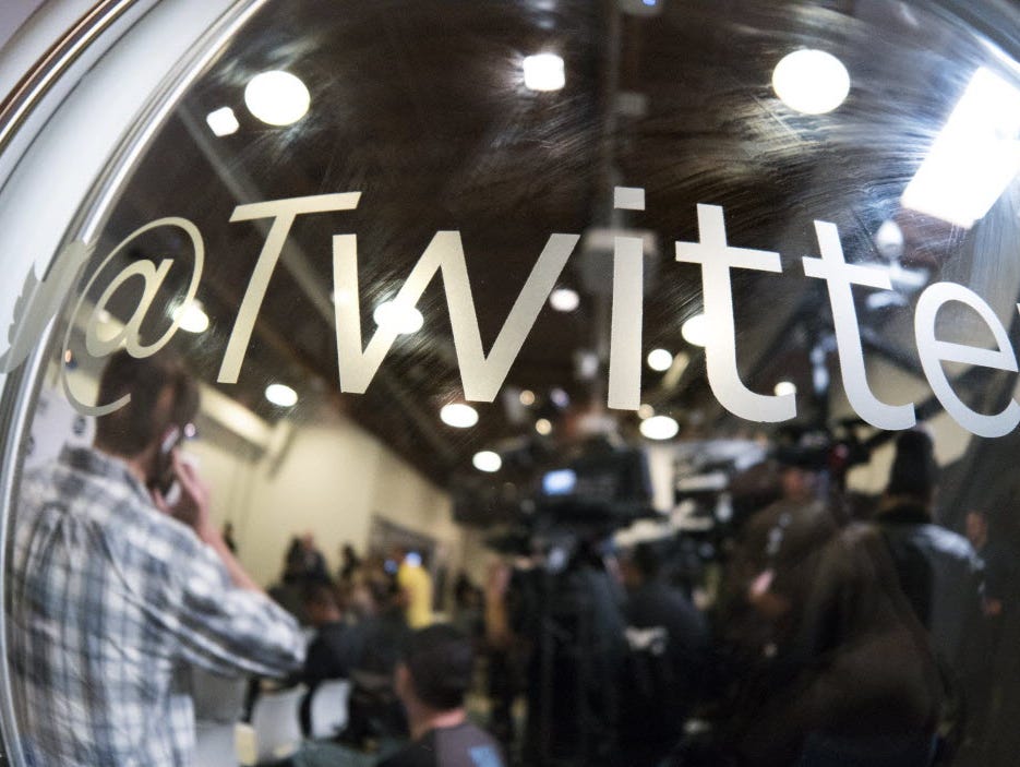 This April 7, 2015 file photo shows people as they wait for a press conference at tech company Twitter's office space in Santa Monica, California.