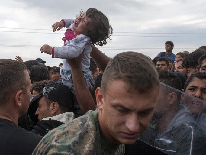 Migrants try to break through the cordon of Macedonian