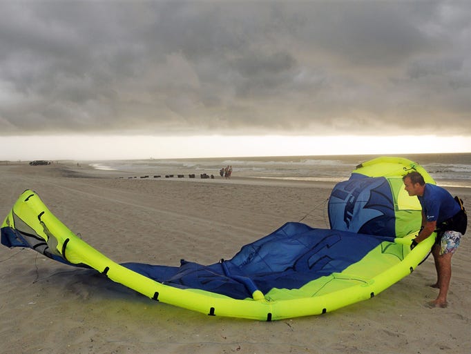 Pete Nero secures his kite board on Carolina Beach.