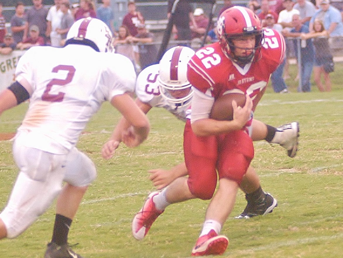 Mikey Chennault splits a pair of defenders Friday night in Jo Byrns 28-11.