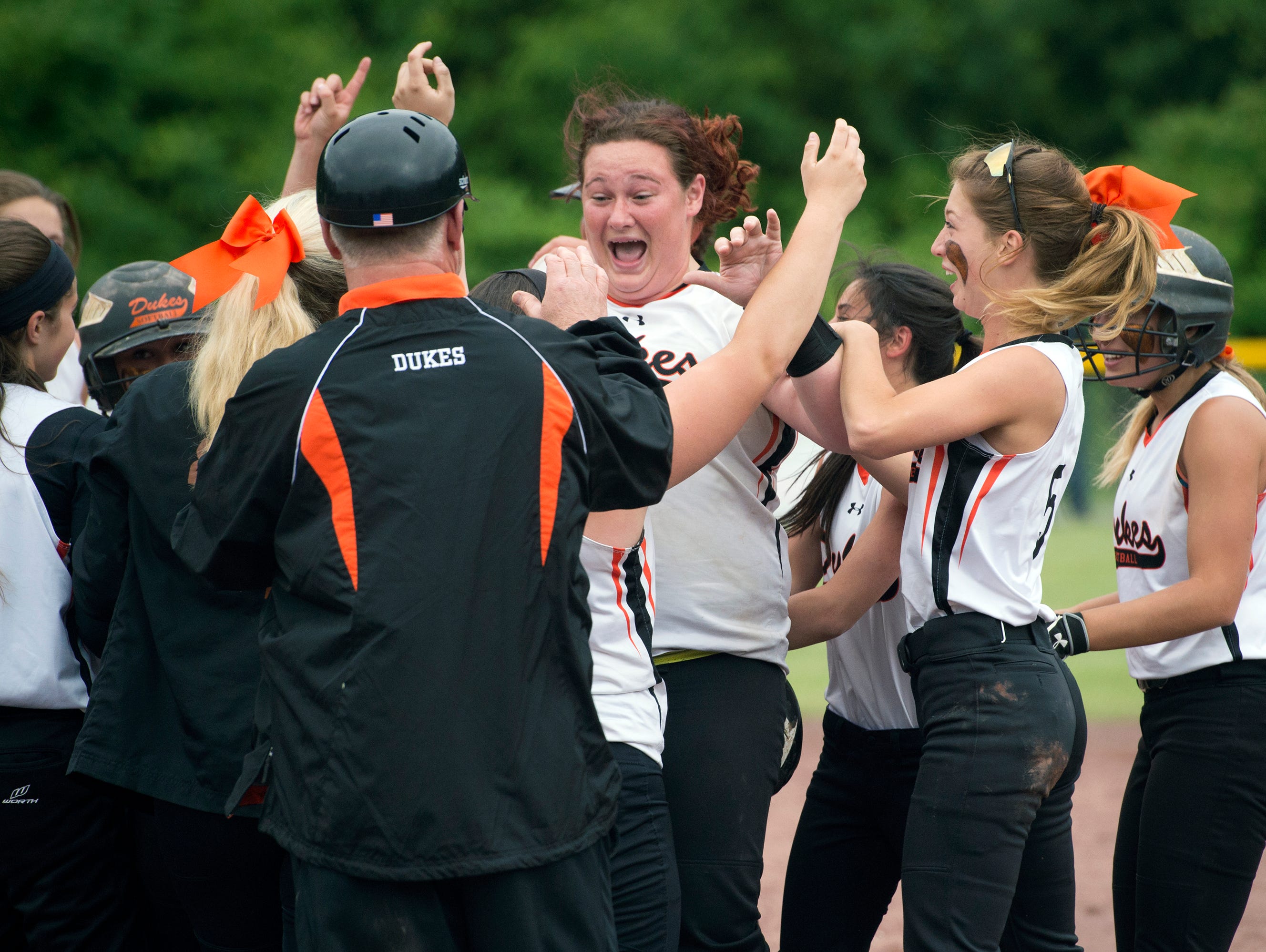 Marlboro High School players celebrate winning the Class B state softball title on Sunday, after defeating Windsor in South Glens Falls.