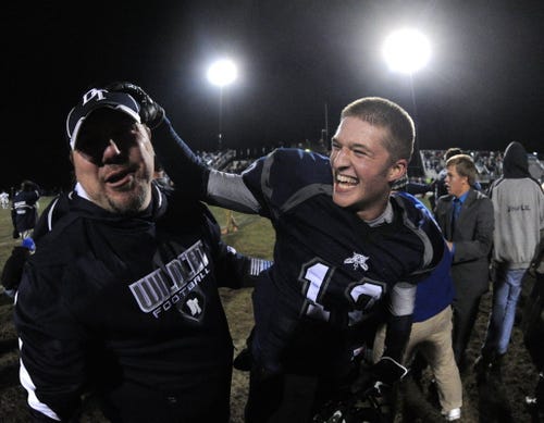 Dallastown QB Andrew Henry, right, celebrates the Wildcats' 21-20 victory against CD East during the District 3 quarterfinals in Dallastown on Nov. 15, 2013. (Jason Plotkin - Daily Record/Sunday News) ID=75276698 ID=75276698