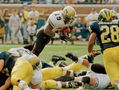 Salaam dives for a touchdown in the 1994 