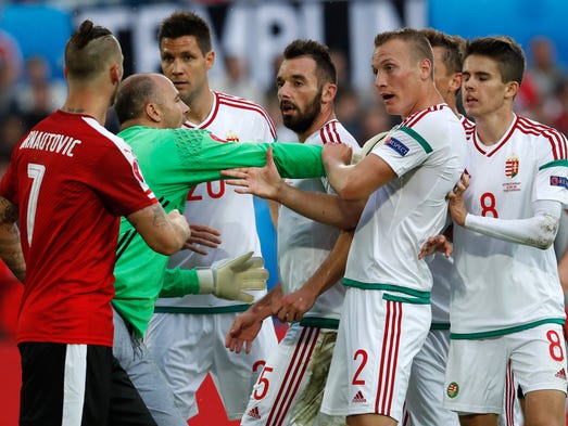 Hungary goalkeeper Gabor Kiraly pushes his teammates