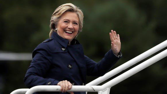 Democratic presidential candidate Hillary Clinton waves