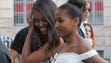 Sasha, right, and Malia walk through Corso Como in