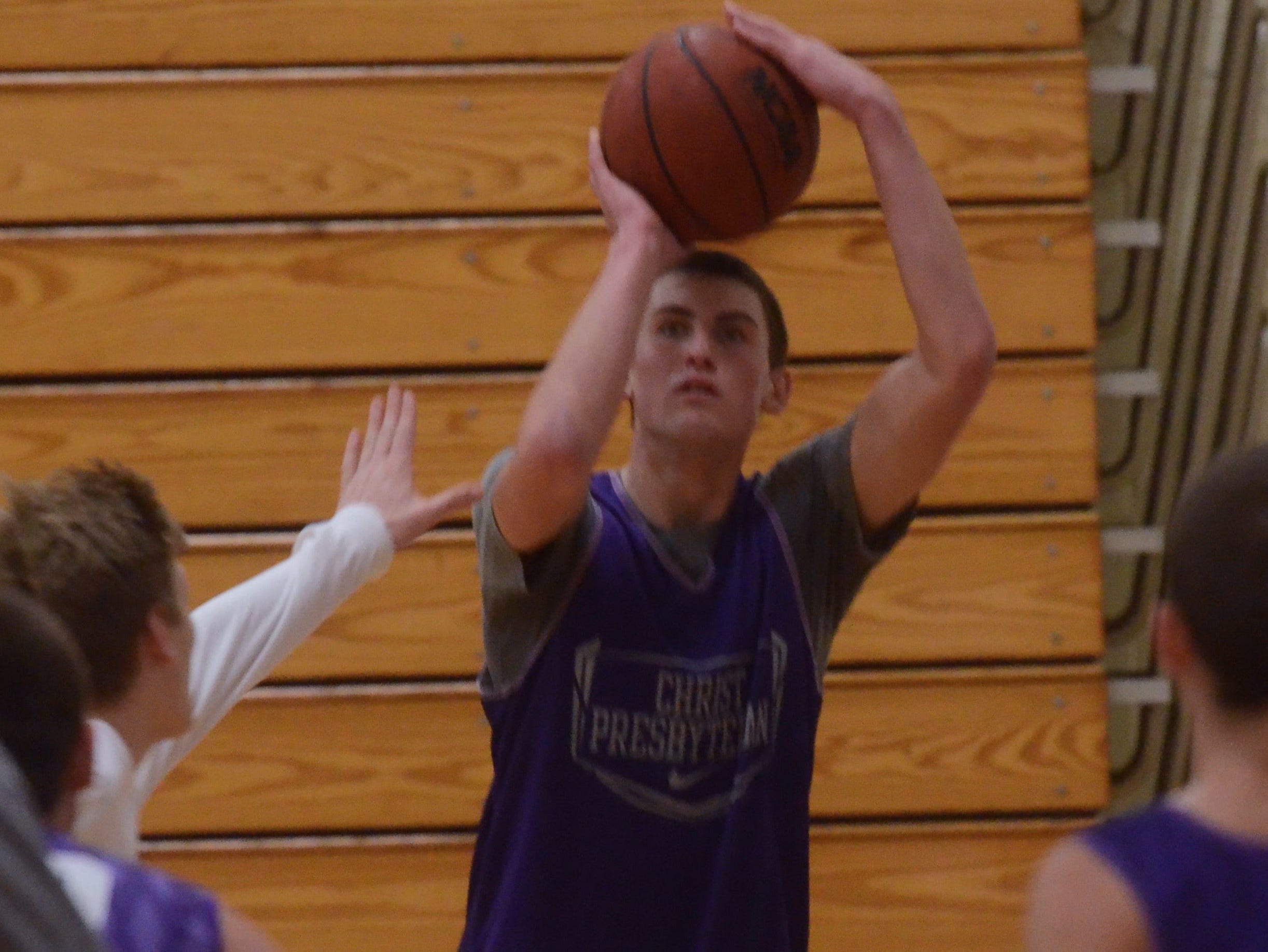 Christ Presbyterian Academy junior Drew Scott shoots a 3-pointer during practice on Wednesday. The Lions have hit 259 3-pointers this season.