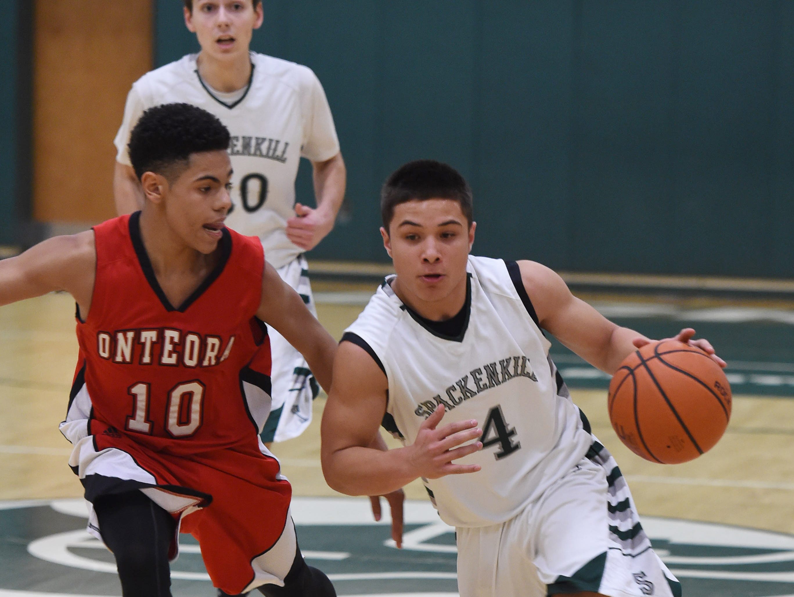 Spackenkill's Camron Abalos drives to the net past Onteora's, Jameson Morton during Thursday's game at Spackenkill.