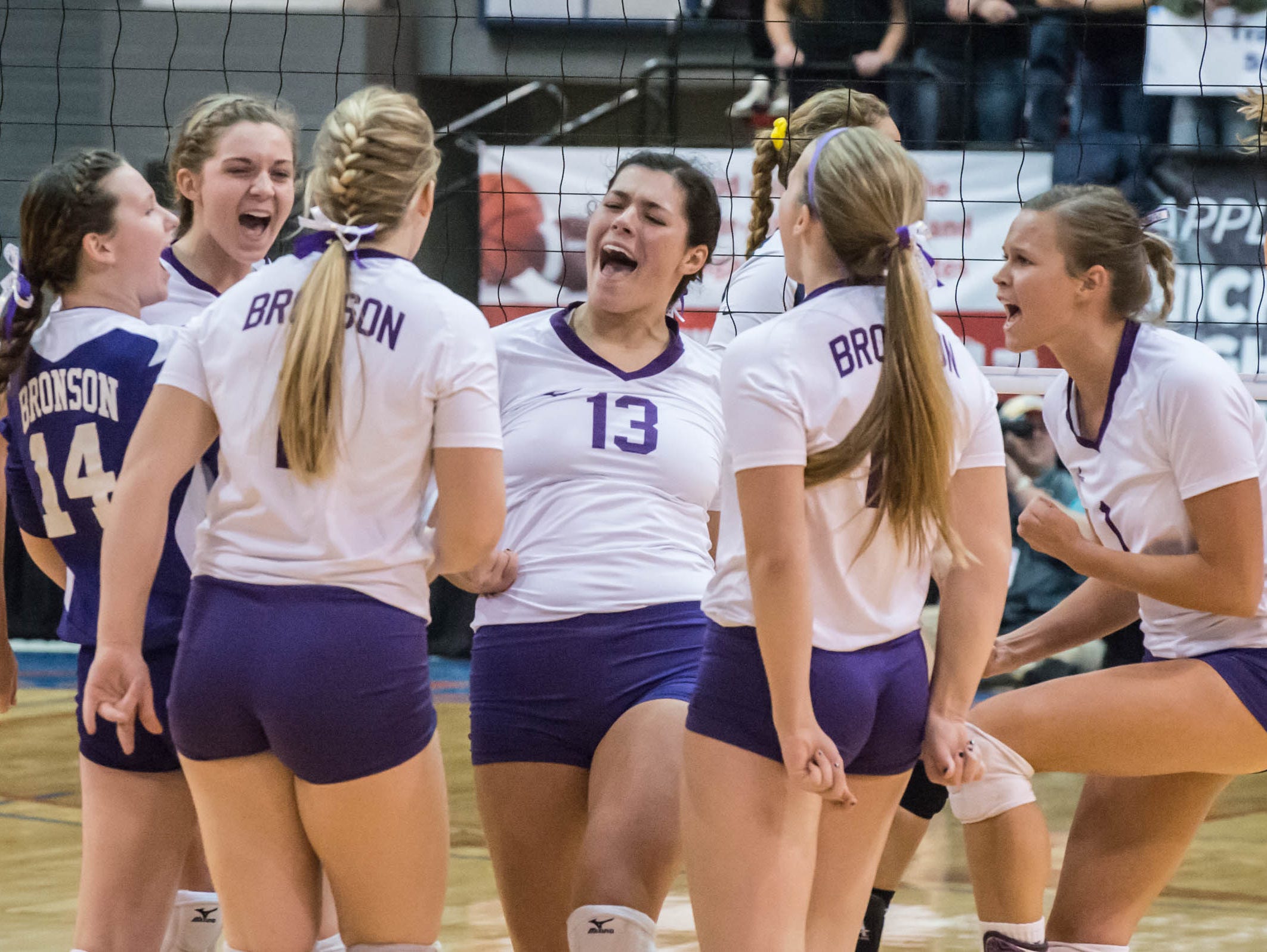Bronson players celebrate after a point during semi-finals against TC St. Francis.