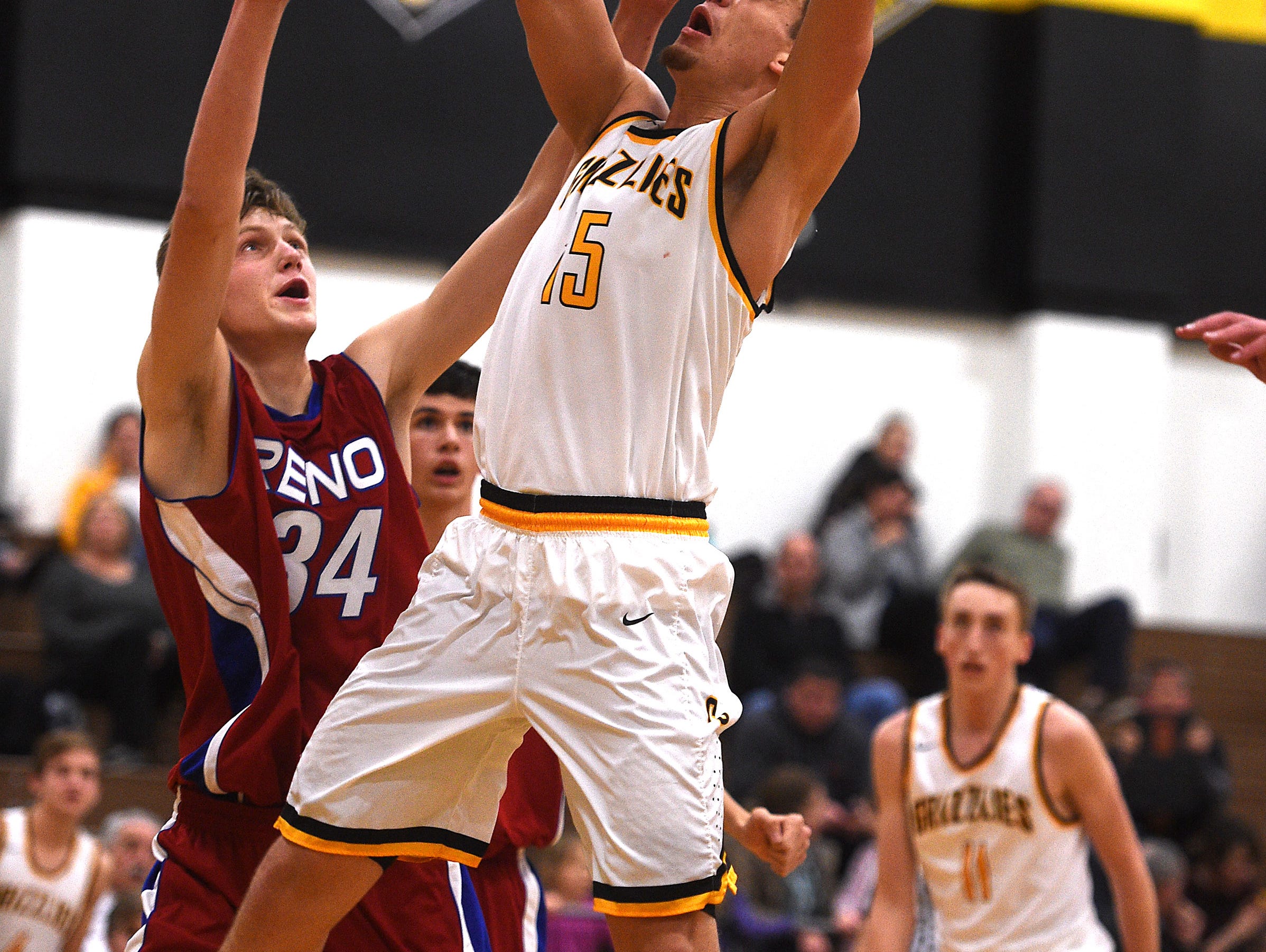 Galena's Dillon Voyles (15) shoots over Reno's Tommy Challis (34) during their basketball game on Jan. 3, 2017.