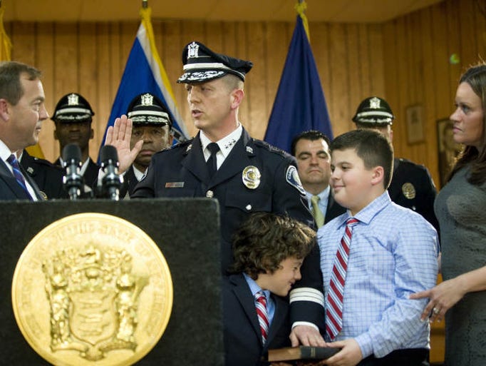 Scott Thomson is joined by (from right) his wife Zabrina, 10-year-old son Jack, and 6-year-old son Drew as Thomson was sworn in as the chief of the Camden County Police Department Metro Division by Camden County Freeholder Director Louis Cappelli, Jr. during a ceremony at Malandra Hall in Camden, N.J.  05.01.13