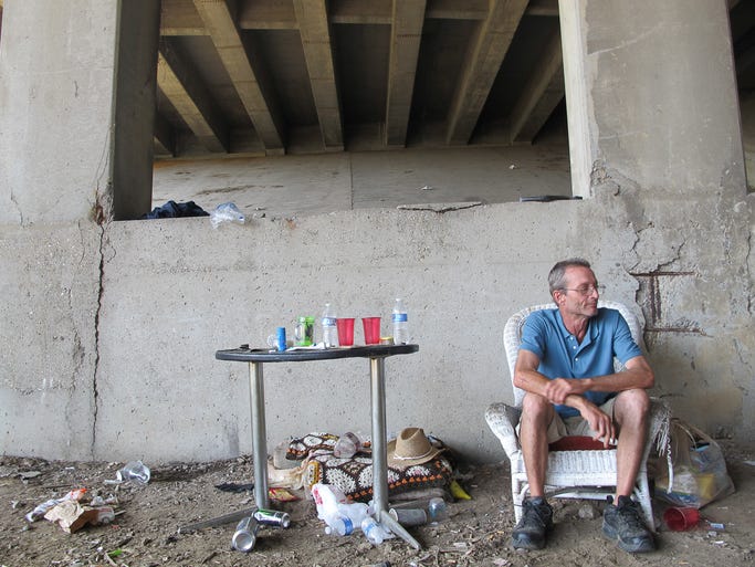 Richmond 'Sapian Docilis' Hurd at his campsite at the 9th Street and Interstate 65 overpass in Jeffersonville, IN. Aug. 14, 2014