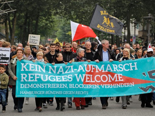 Demonstrators   carry a banner that reads "Kein Nazi-Aufmarsch