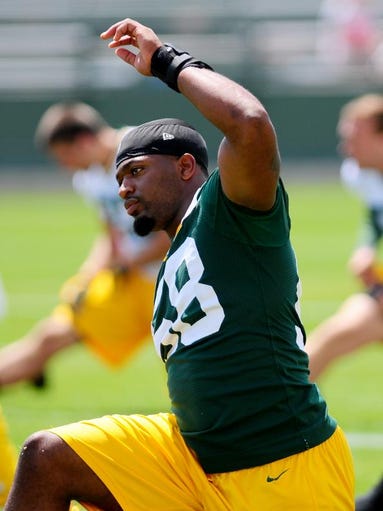 Green Bay Packers linebacker Sam Barrington stretches during minicamp practice at Ray Nitschke Field, Tuesday, June 17, 2014. H. Marc Larson/Press-Gazette Media
