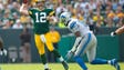 Green Bay Packers quarterback Aaron Rodgers (12) throws
